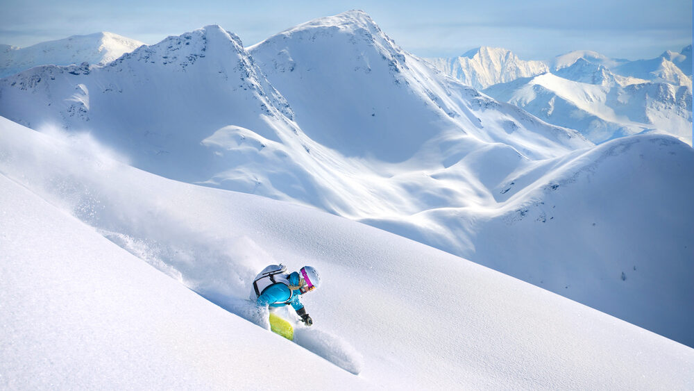 Skier flying down a ski run at Jackson Hole Ski Resort