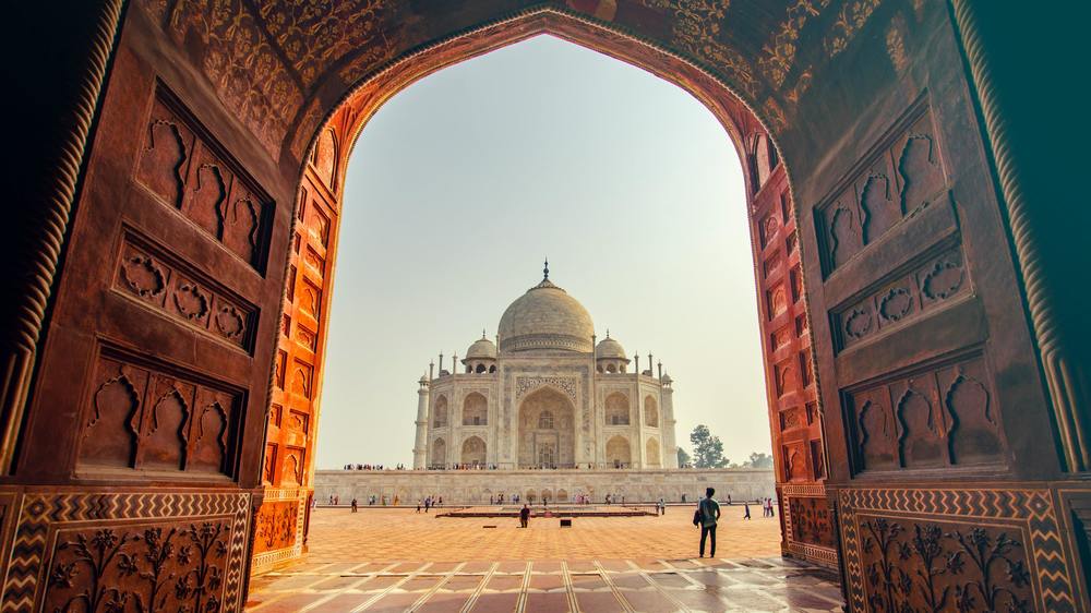 The Taj Mahal as seen through on of the archway's in the surrounding area