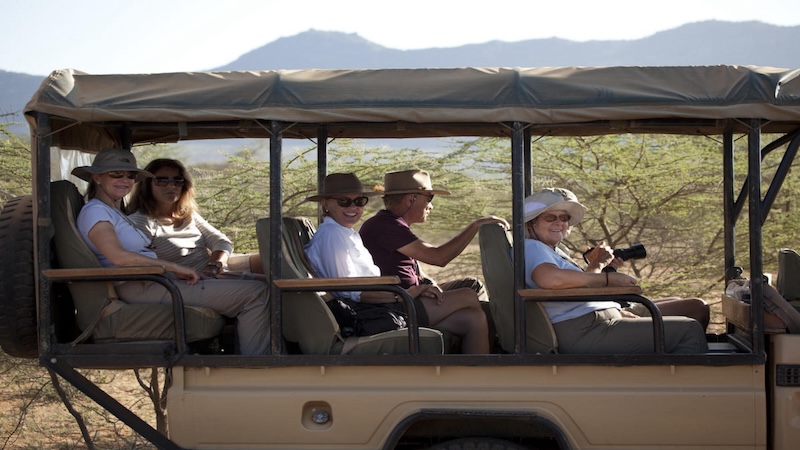 Inspirato members in a safari truck.