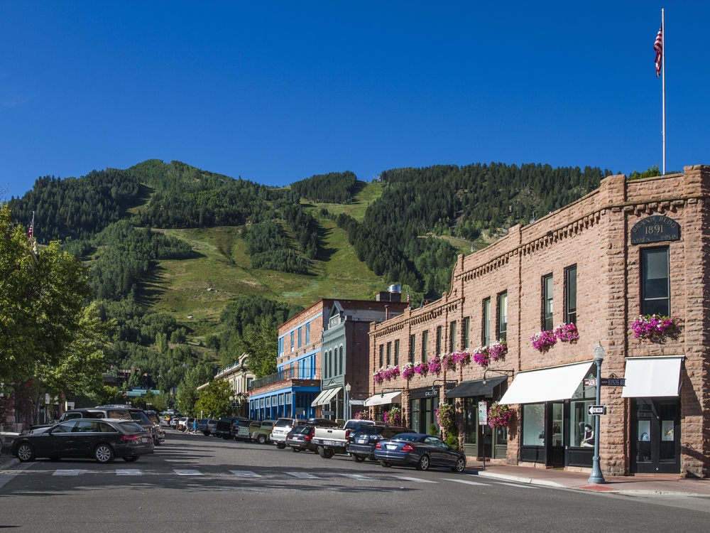 Aspen street in the summer with Aspen Mountain in the background. 