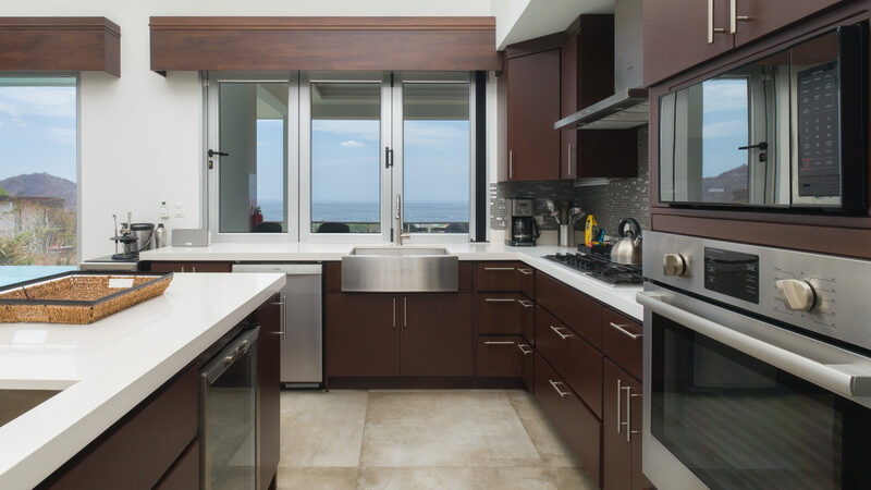 Villa Lantana kitchen with stainless steel appliances and ocean views.